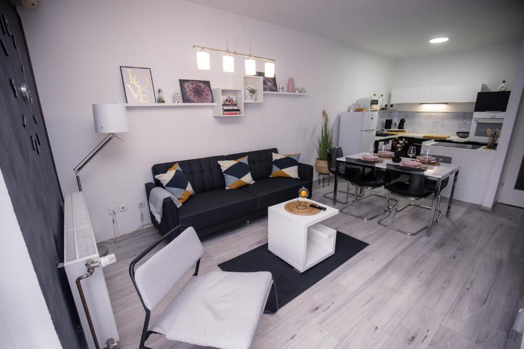 a living room with a couch and a table at Apartman Day in Čakovec
