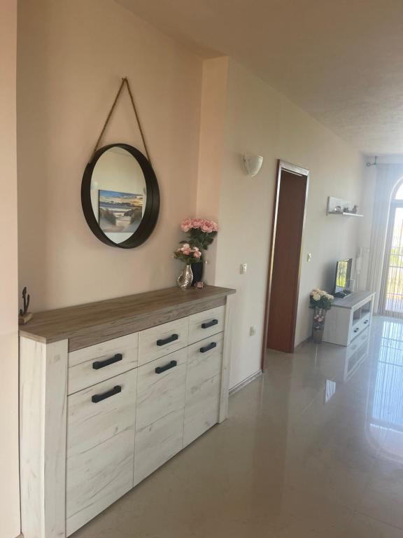 a room with a dresser with a mirror on the wall at Private Apartment with Sea View in Sozopol