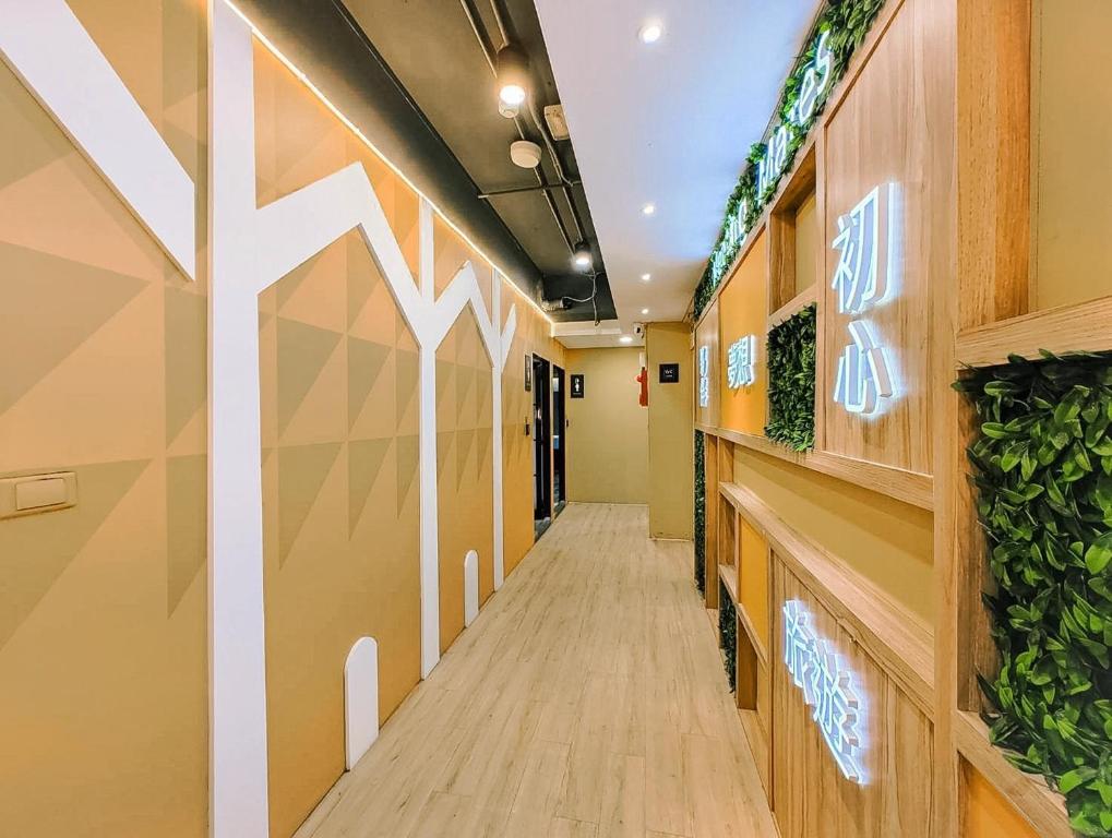 a hallway of an office building with a long corridor at Meeting Mates Hostel in Taipei
