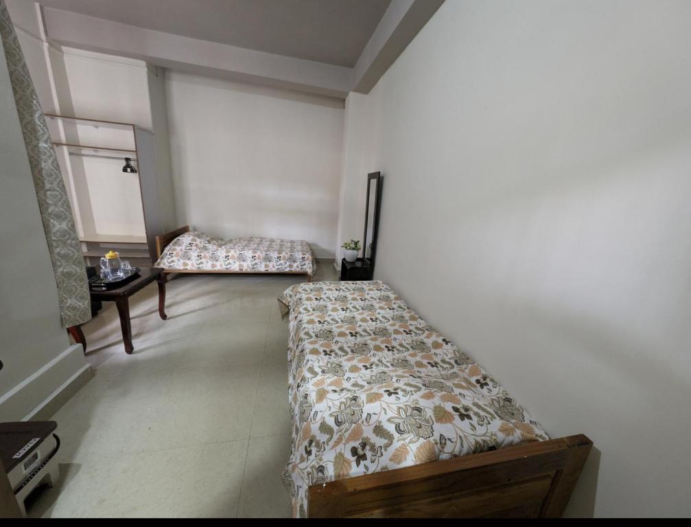 Een bed of bedden in een kamer bij RT Mutbu