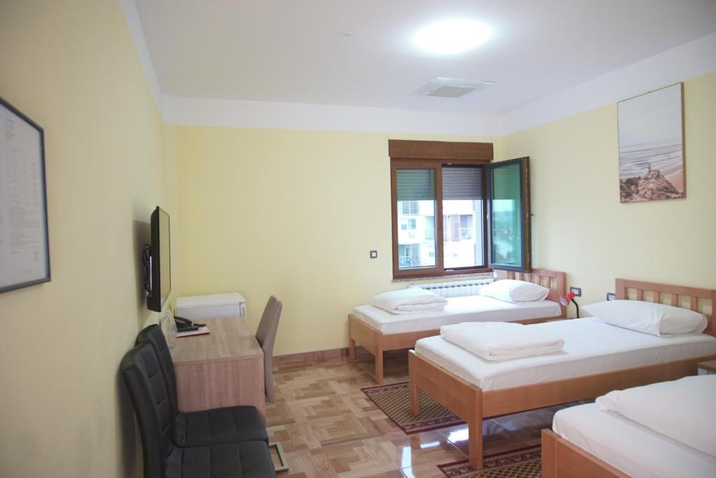 Postel nebo postele na pokoji v ubytování Hotel Europa