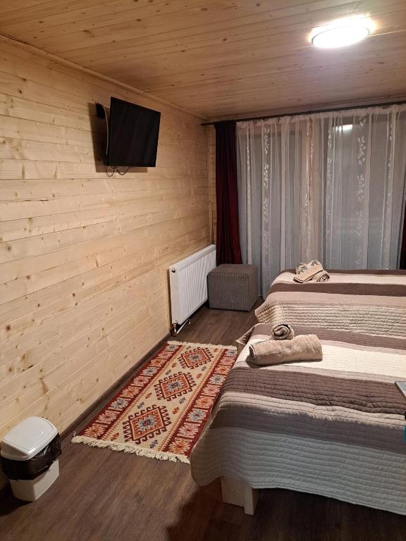 Postel nebo postele na pokoji v ubytování Cabana Alpha