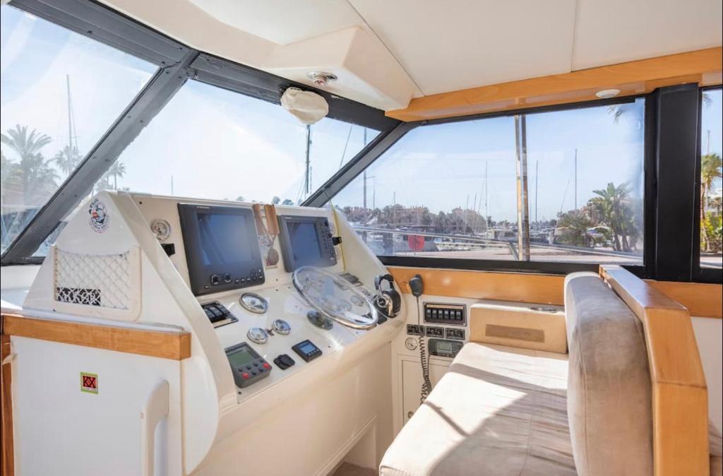 a view of the cockpit of a boat at Barco Americano Sotogrande in Torreguadiaro