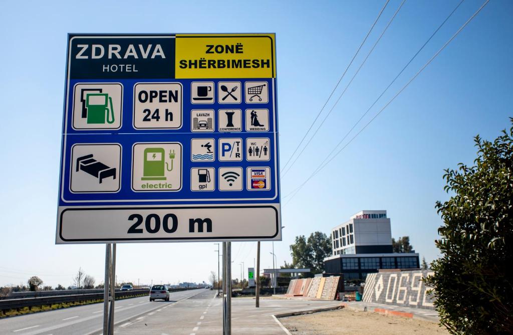 a gas station sign on the side of a highway at Resort Zdrava in Savër