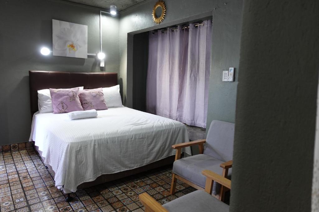 Postel nebo postele na pokoji v ubytování D Sanctum Resort