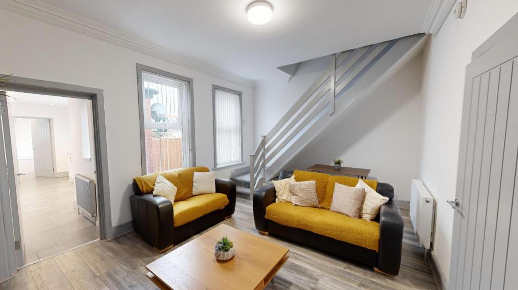 a living room with two couches and a table at Stunning City Centre 2024 Refurb in Sunderland