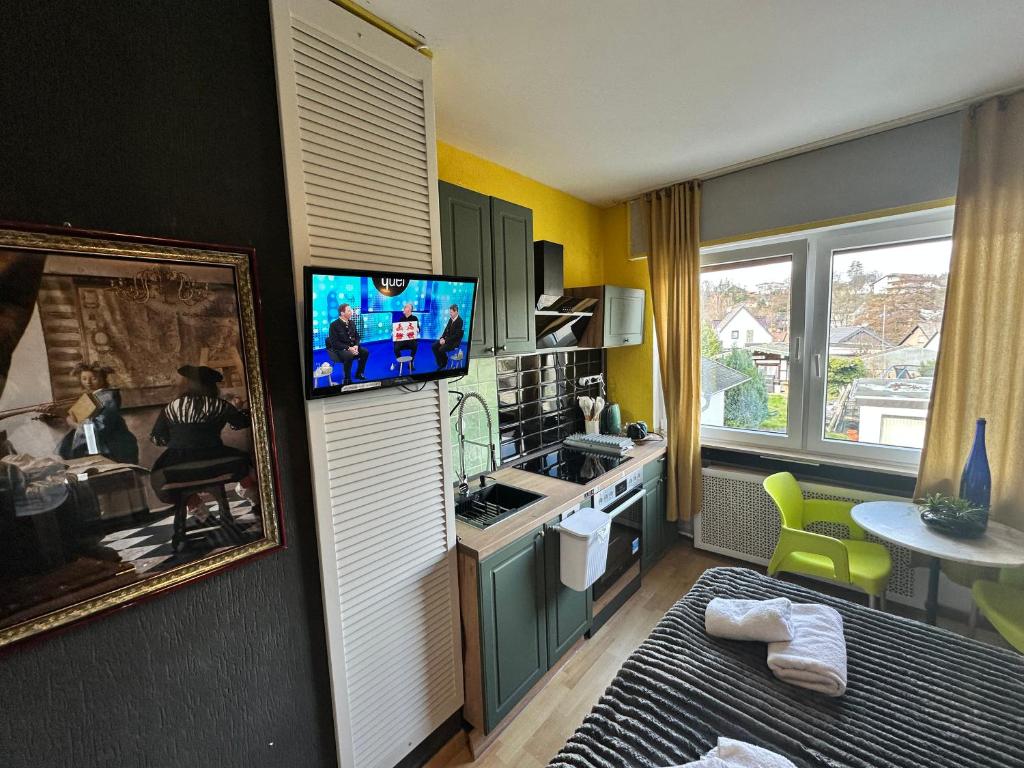 TV a/nebo společenská místnost v ubytování Green Seeblick Hotel am See