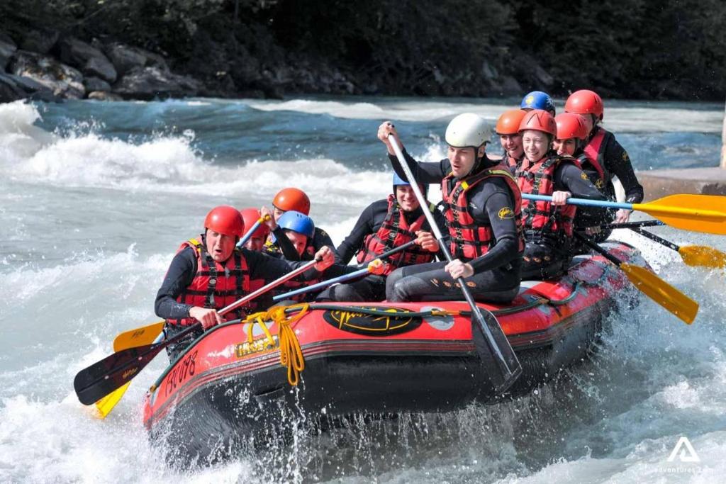 a group of people in a raft in the water at Ceylon Adventure Sports in Kitulgala
