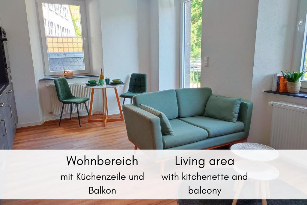 a living room with a couch and a table at Mosel-Blick: Charme & Komfort in Bremm