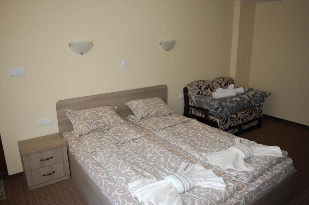 A bed or beds in a room at Guest House Savina