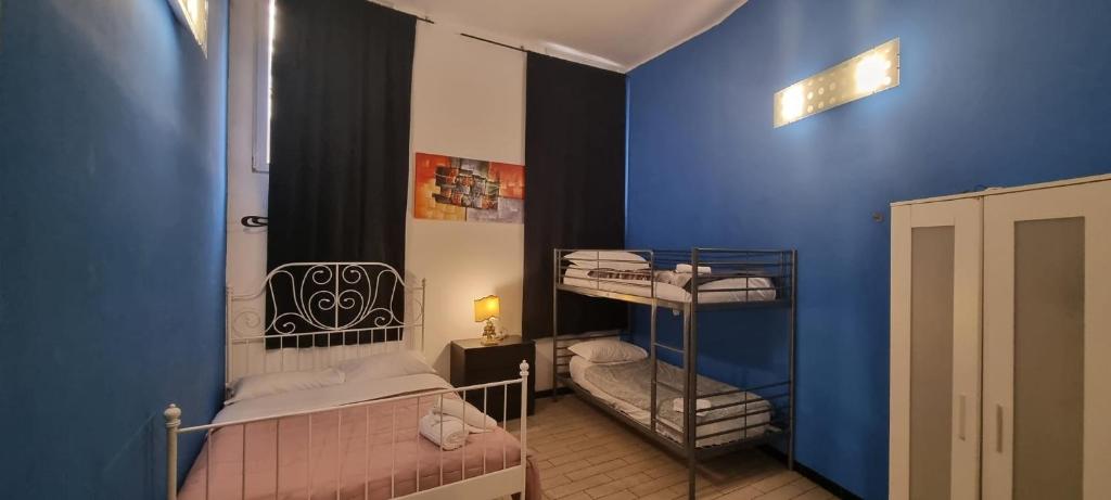 Postel nebo postele na pokoji v ubytování Family Hostel Milano