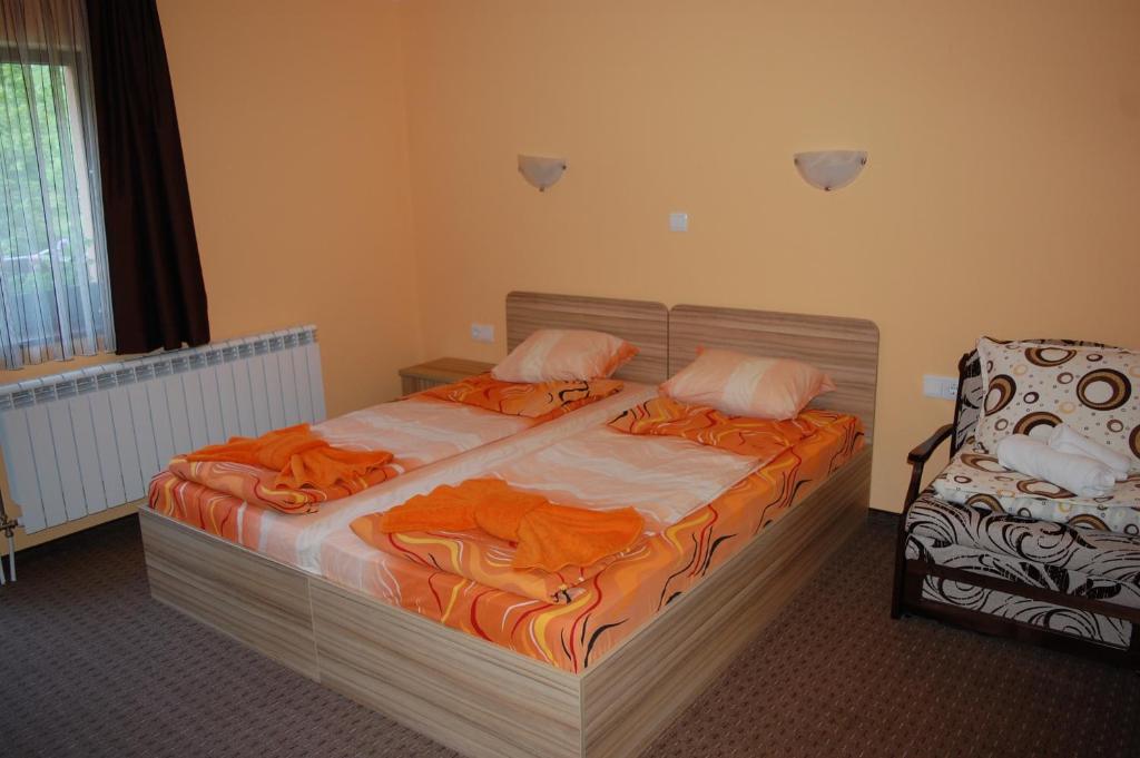A bed or beds in a room at Guest House Savina