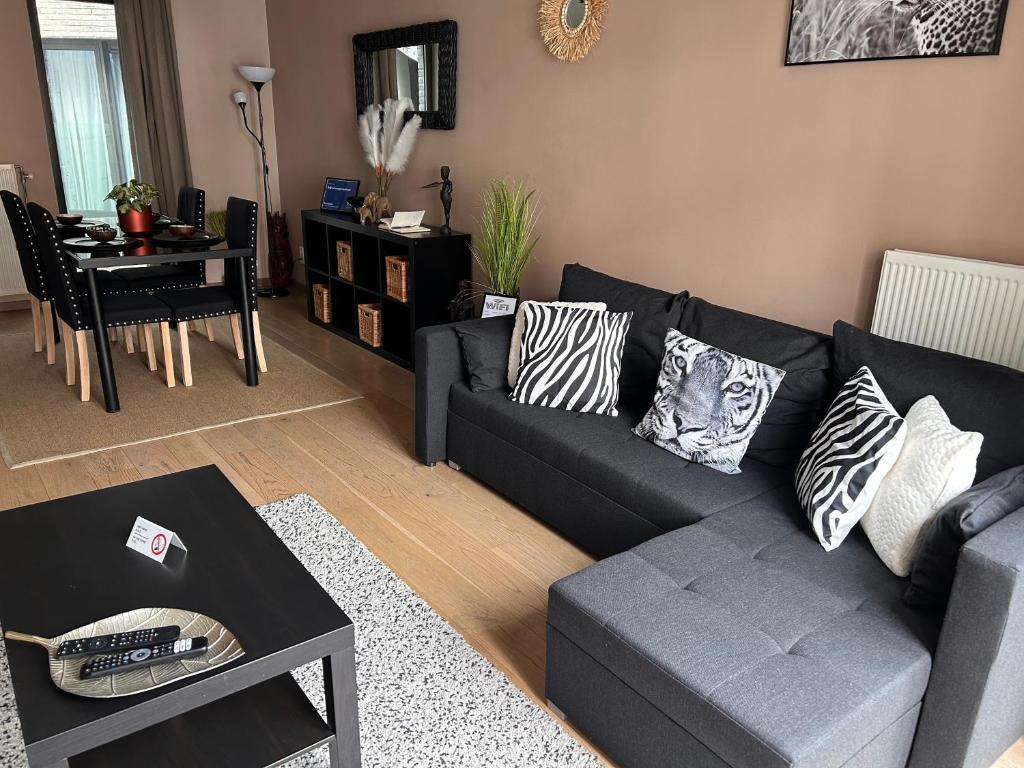 a living room with a couch and a table at BnB Antwerp Centrum in Antwerp
