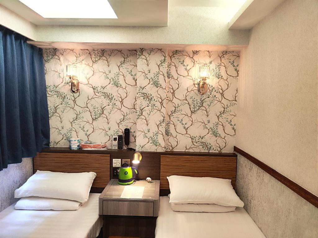Postel nebo postele na pokoji v ubytování Celltronik Hostel 先創旅店