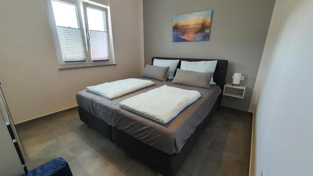 Postel nebo postele na pokoji v ubytování Apartments Erdgeschoss Villa Casper