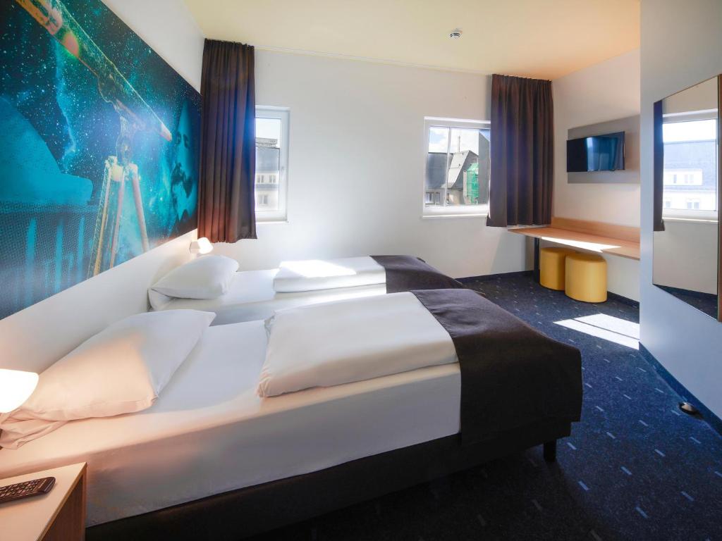Voodi või voodid majutusasutuse B&B Hotel Jena toas