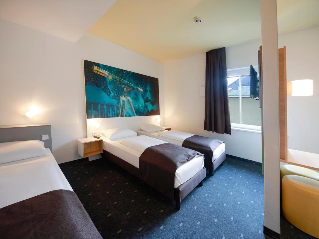 Voodi või voodid majutusasutuse B&B Hotel Jena toas