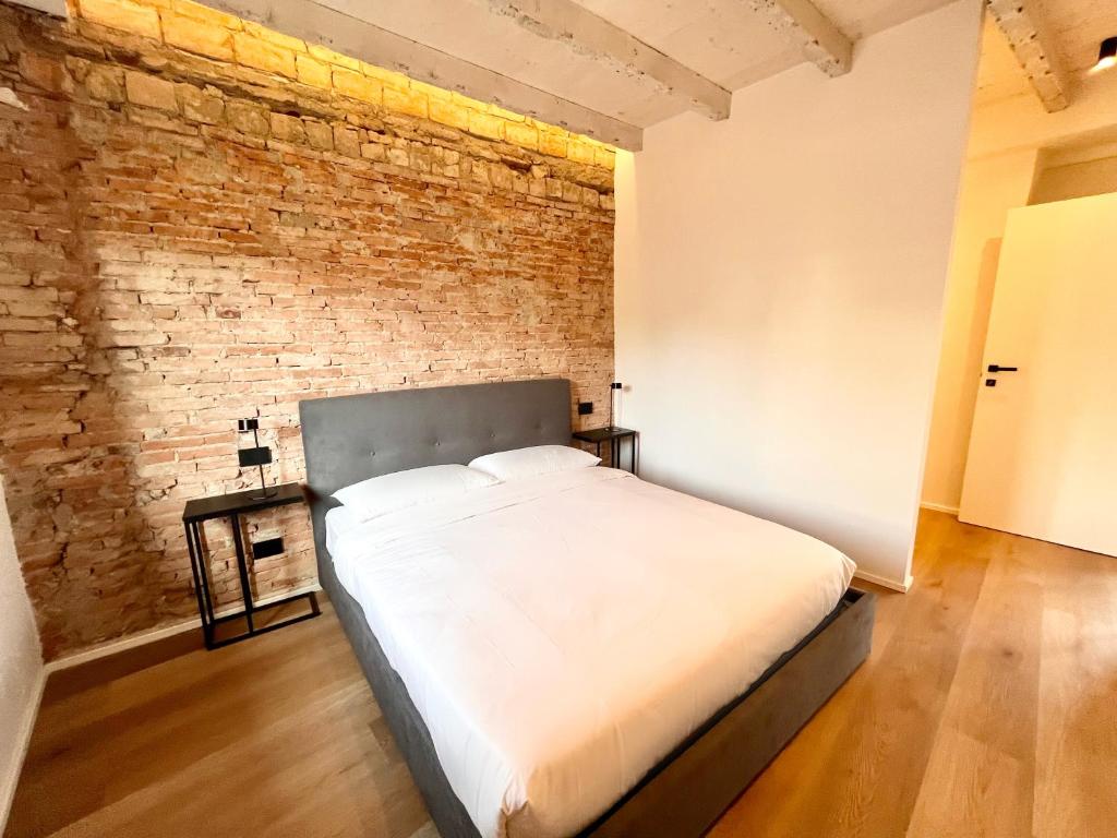 Postel nebo postele na pokoji v ubytování LaMeCa Bergamo