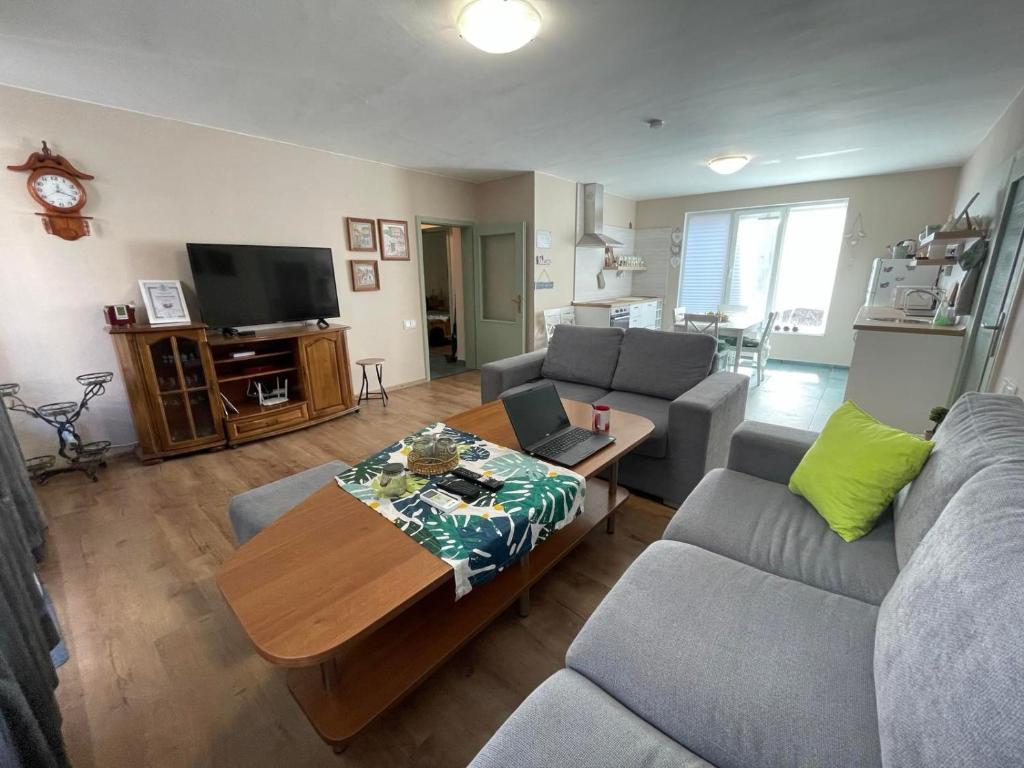 a living room with a couch and a table at NiDo Cozy 3BR Apartment Kapana Top Center in Plovdiv