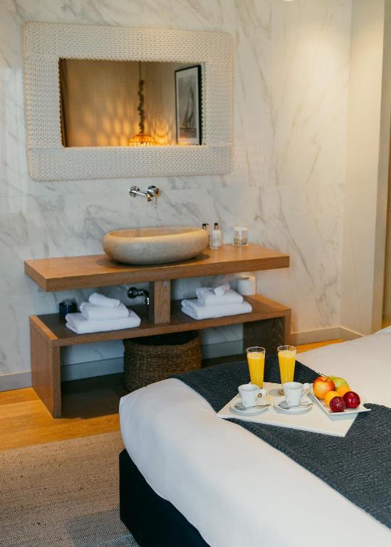 Postel nebo postele na pokoji v ubytování Oniro Suites