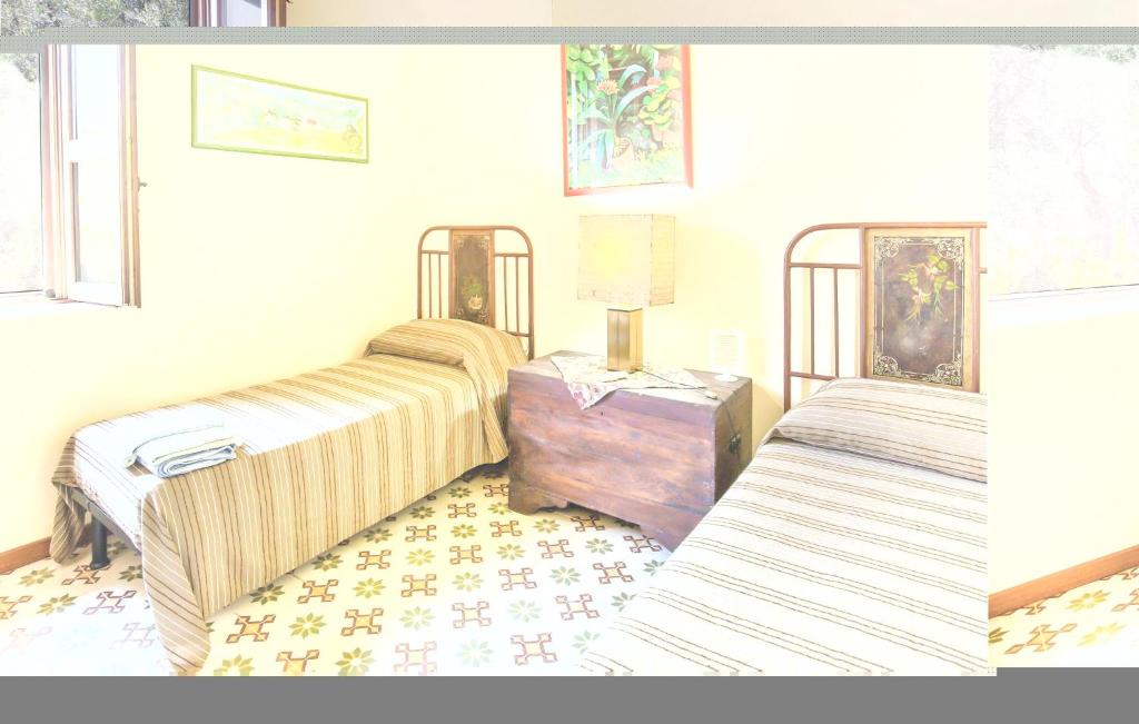 A bed or beds in a room at Casale Malena