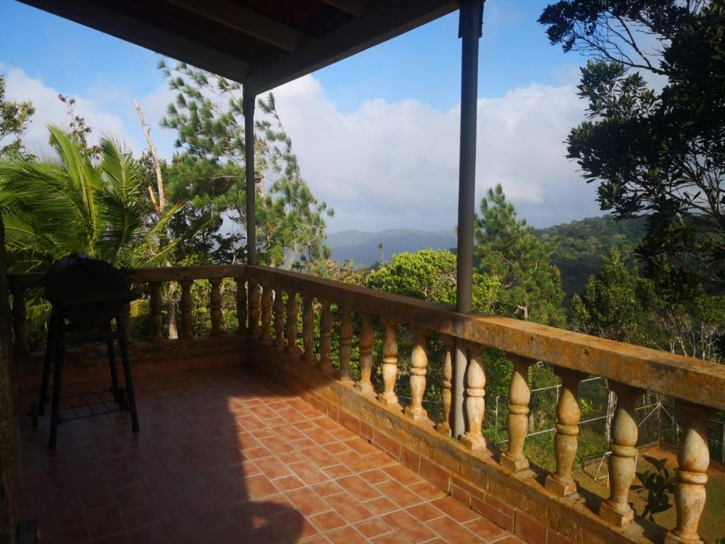 a balcony with a view of the mountains at Sonidos de la Naturaleza!! in Los Altos de Cerro Azul