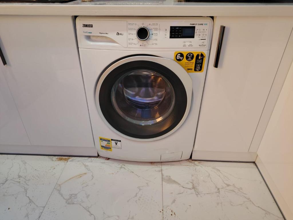 a washing machine sitting in a counter top at Blue Whale Hurghada Beach Front Apartments City Centre in Hurghada