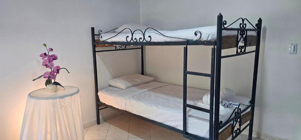Cama o camas de una habitación en Cabañas Cafeteras Cerritos