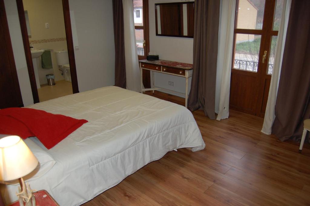 Postel nebo postele na pokoji v ubytování Posada Casa Juanes