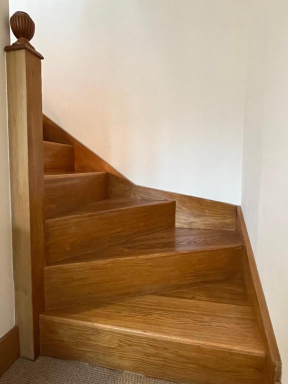 a set of wooden stairs in a room at The Georgian House in London