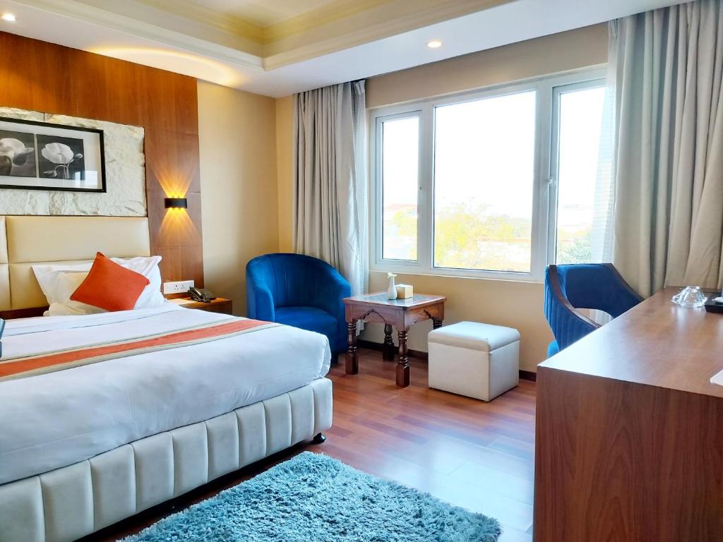 Postel nebo postele na pokoji v ubytování Kumari Boutique Hotel