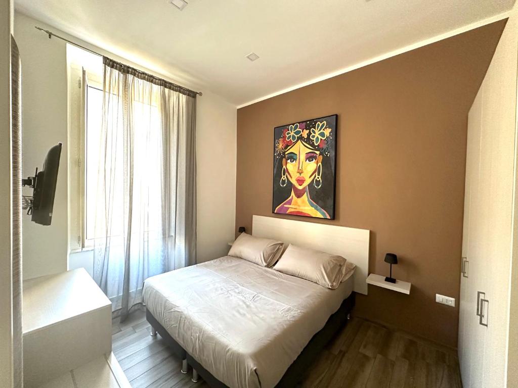 Ένα ή περισσότερα κρεβάτια σε δωμάτιο στο Dimora Centrale Home