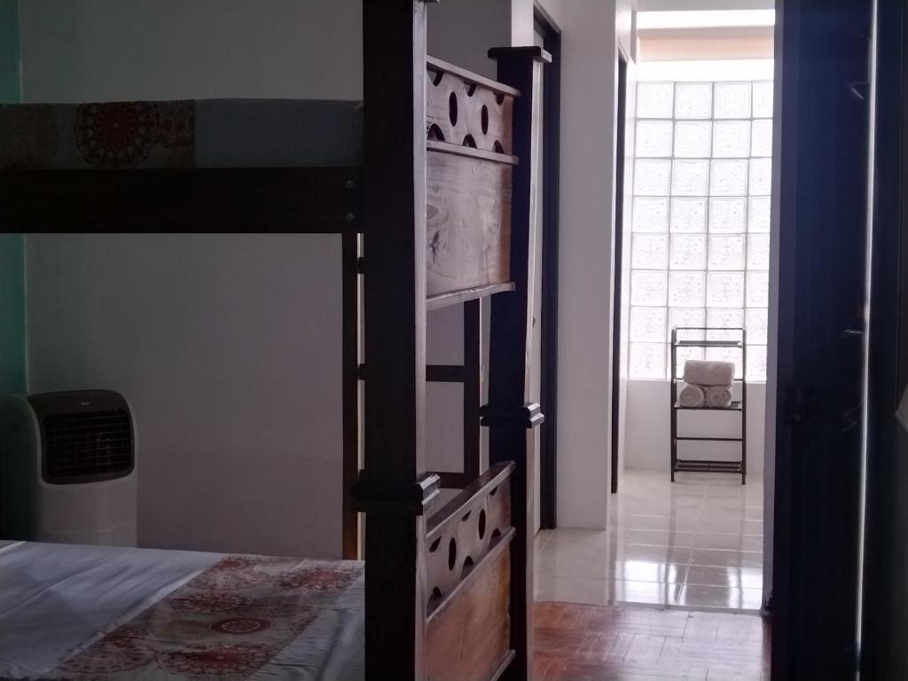 Postel nebo postele na pokoji v ubytování Lajuela BnB & Hostel