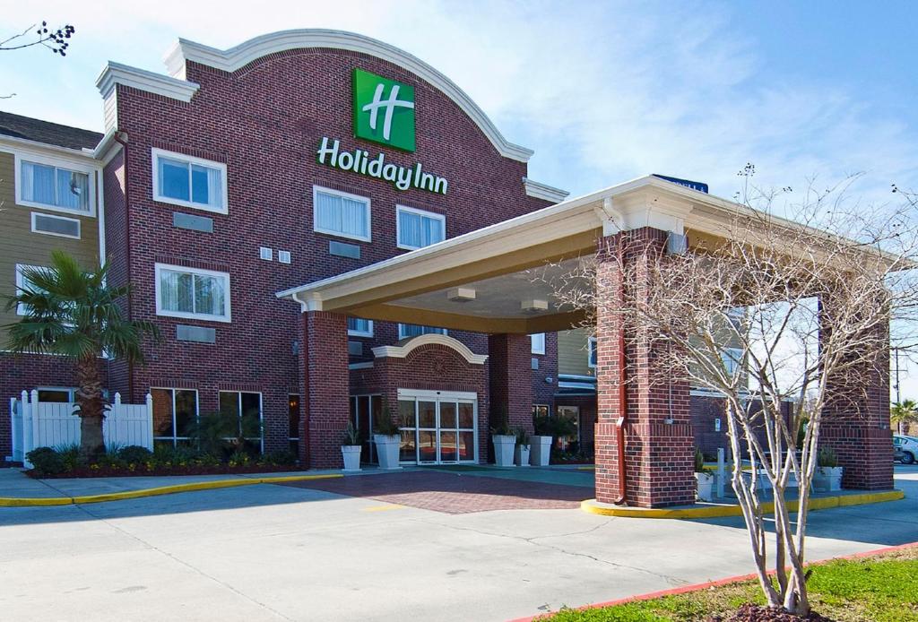 a hotel building with a hilton sign on it at Holiday Inn Hotel & Suites Slidell, an IHG Hotel in Slidell