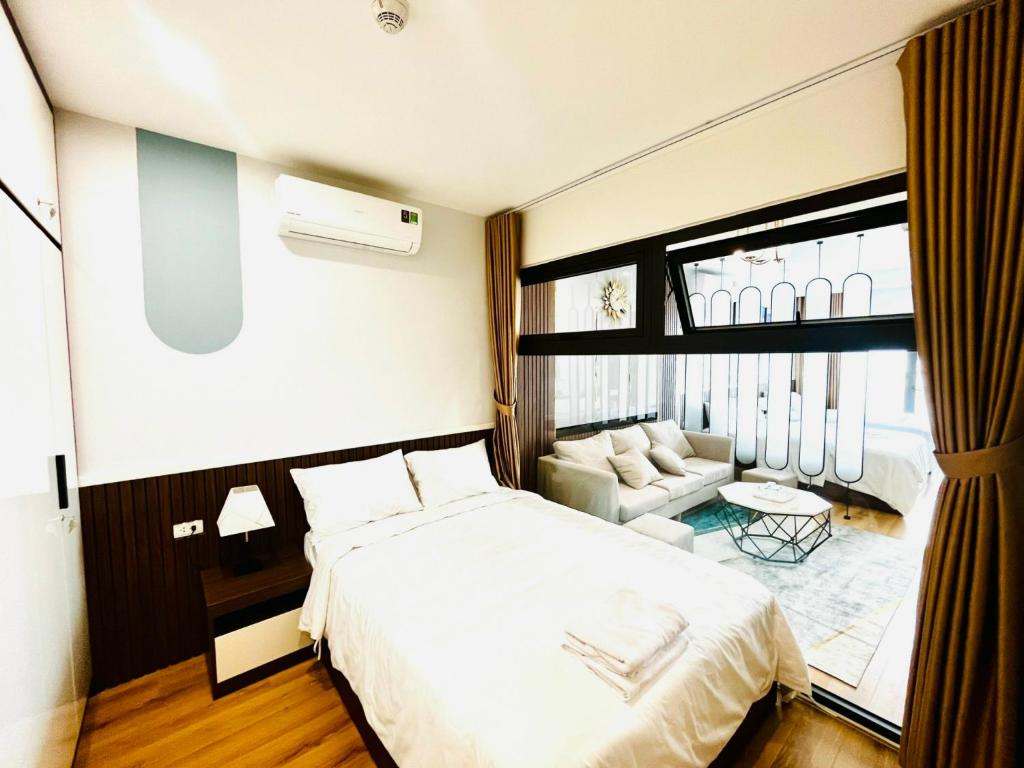 Postel nebo postele na pokoji v ubytování Căn Hộ TMS View Biển Quy Nhơn