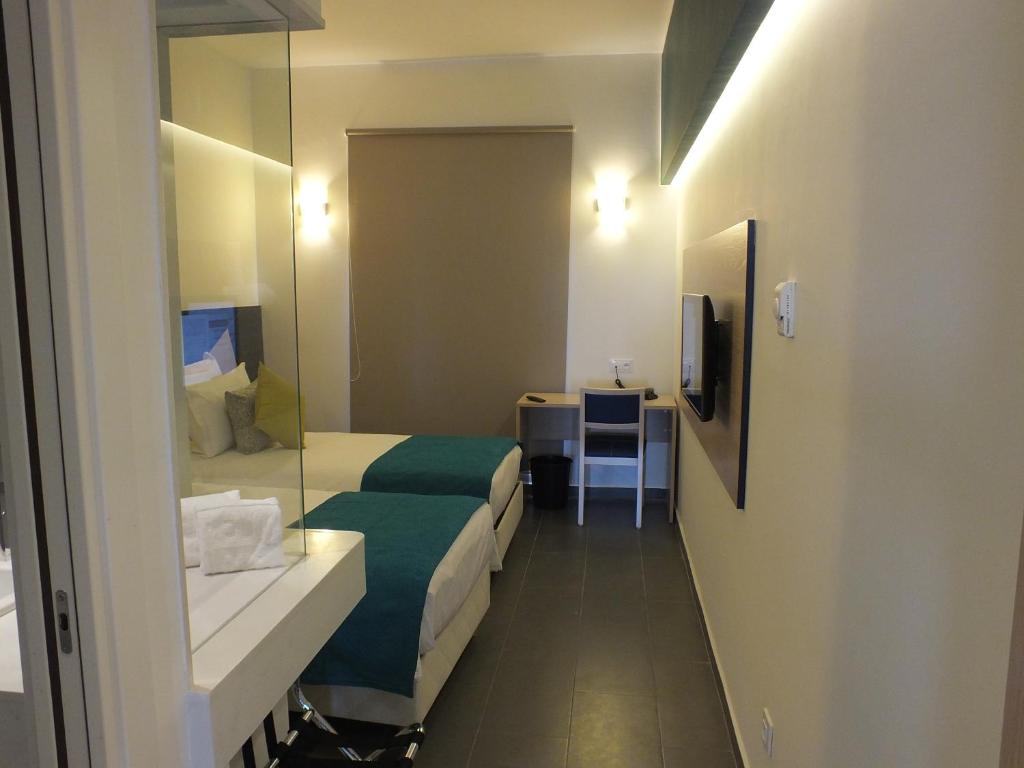 Postel nebo postele na pokoji v ubytování Hotel Relax Marrakech