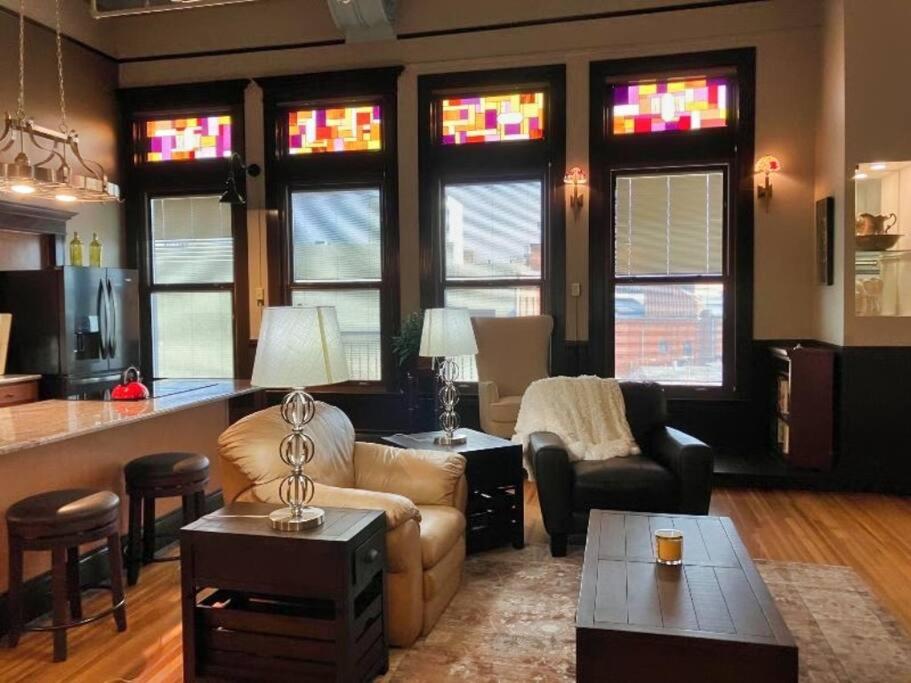 a living room with a couch and a table at Pet Friendly Gorgeous Downtown Loft Pueblo in Pueblo