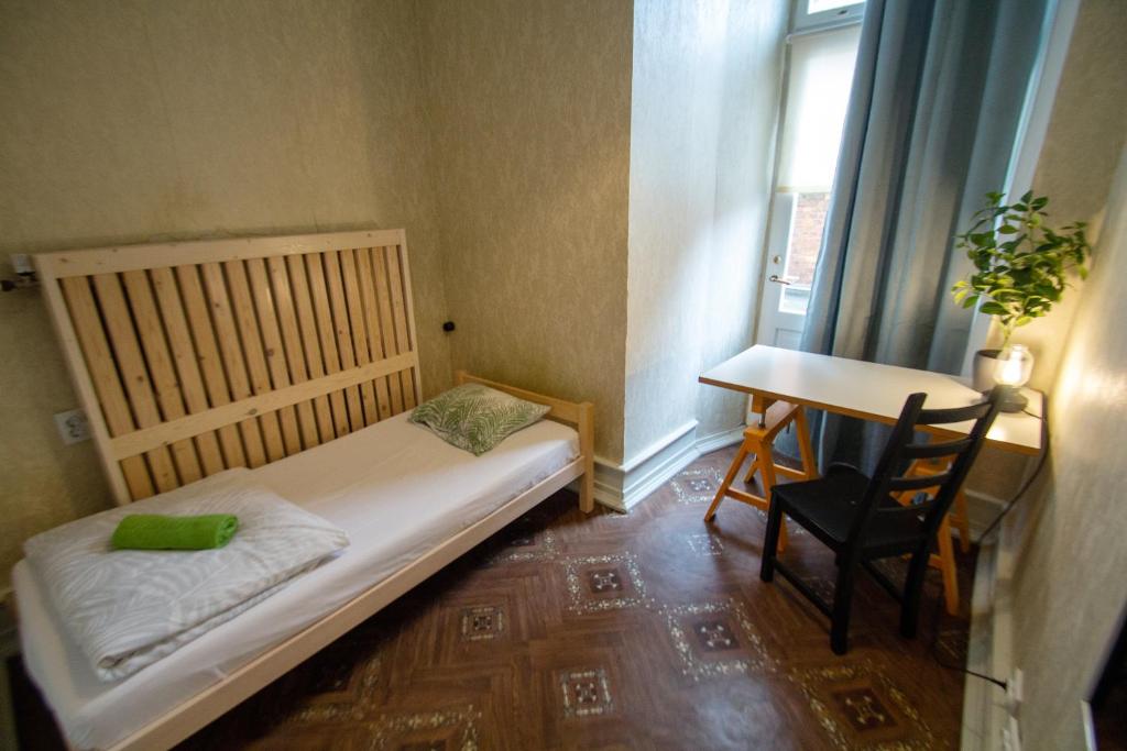 Postel nebo postele na pokoji v ubytování Imaginary Hostel