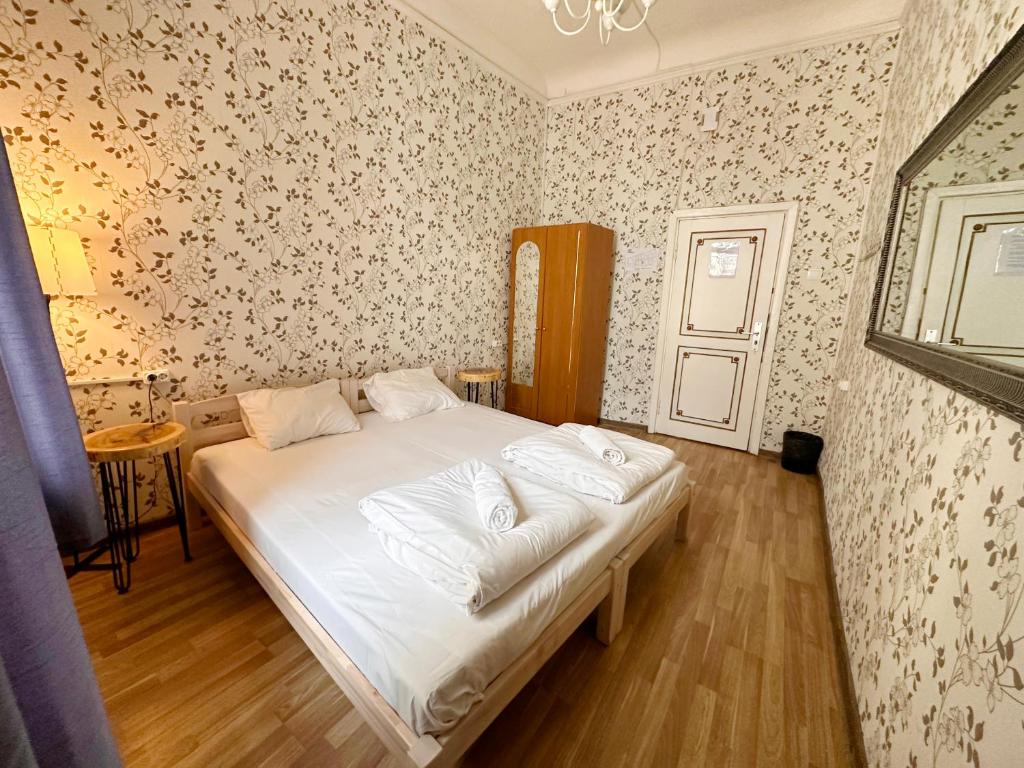 Postel nebo postele na pokoji v ubytování Imaginary Hostel