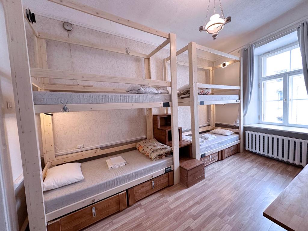 Postel nebo postele na pokoji v ubytování Imaginary Hostel
