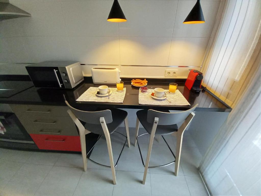 Kuchyň nebo kuchyňský kout v ubytování Littore TORMES con Parking, AA y Piscina