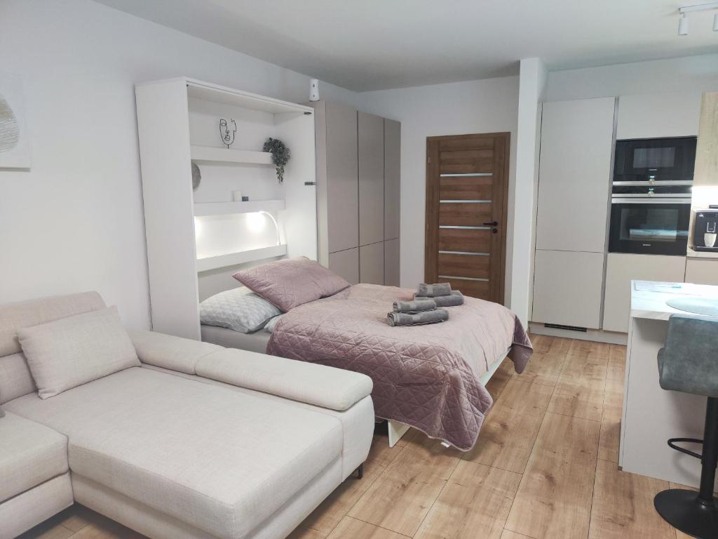 Un pat sau paturi într-o cameră la Nový Útulný Apartmán Katka Rajecké Teplice