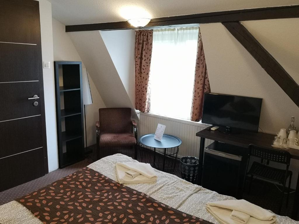 Postel nebo postele na pokoji v ubytování Kikelet Villa
