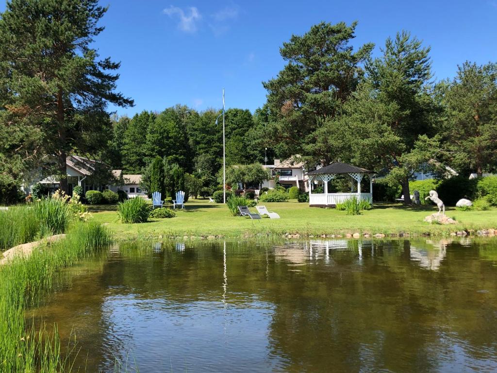 a view of a pond with a gazebo at Käsmu Merekalda Apartments - Adults only in Käsmu