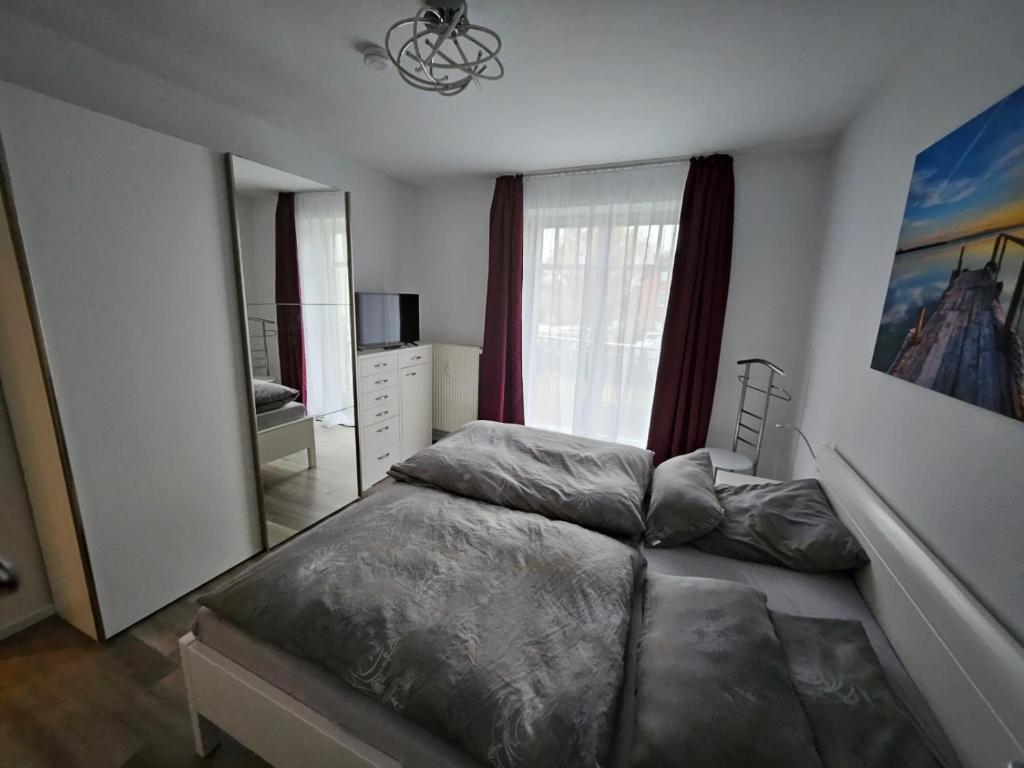 Postel nebo postele na pokoji v ubytování Strandallee 150a