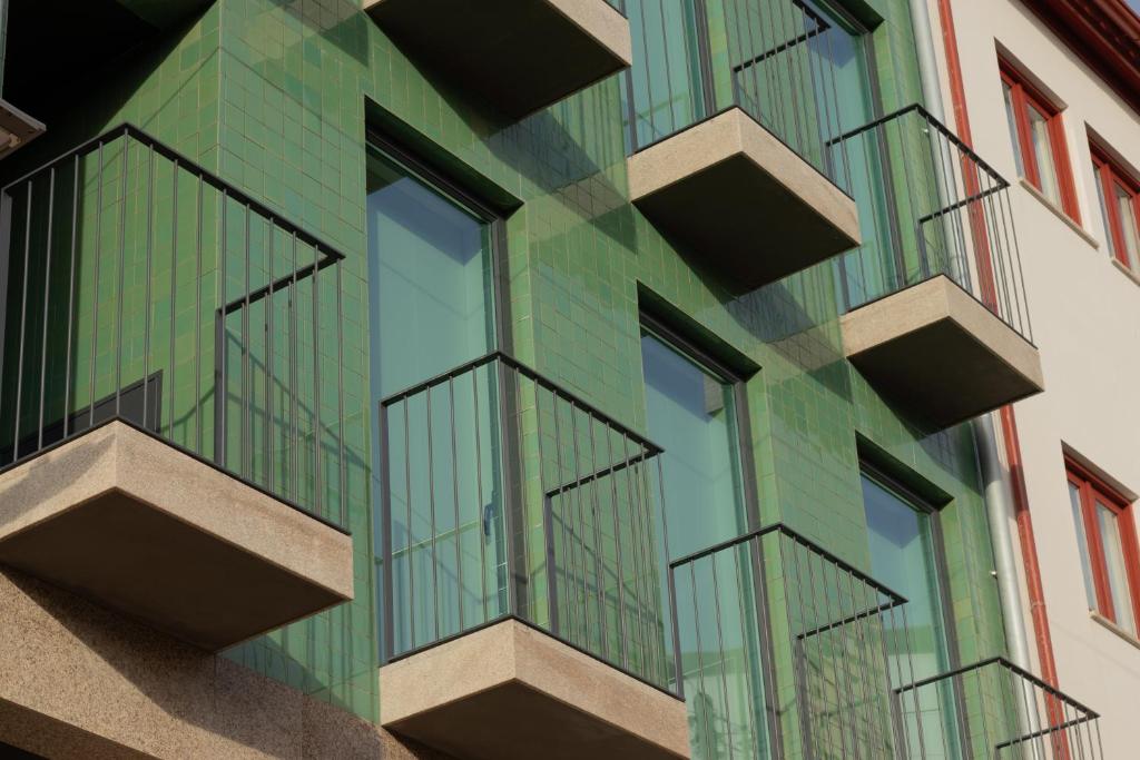 a facade of a building with balconies at Casa da Carvoaria in Vila Real