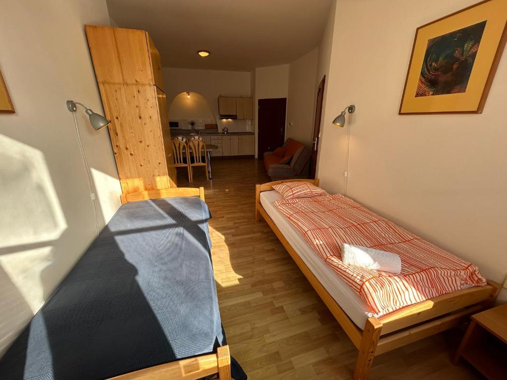 Postel nebo postele na pokoji v ubytování Penzion Maják