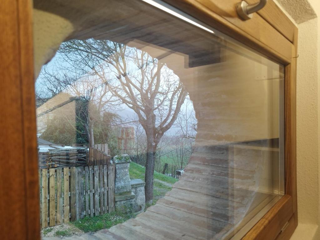a window with a view of a walkway at Villetta Vittoria Country House. La depandance in Pennabilli