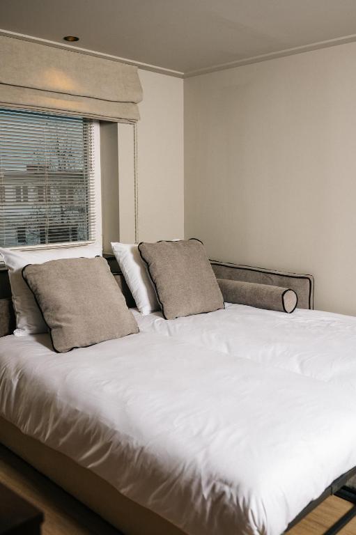 Postel nebo postele na pokoji v ubytování Hotel Blink