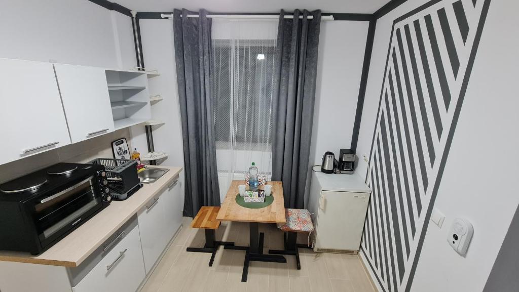 Kuchyň nebo kuchyňský kout v ubytování Pomiculturii Residence 3